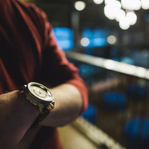 Close up of a watch on a man's wrist.