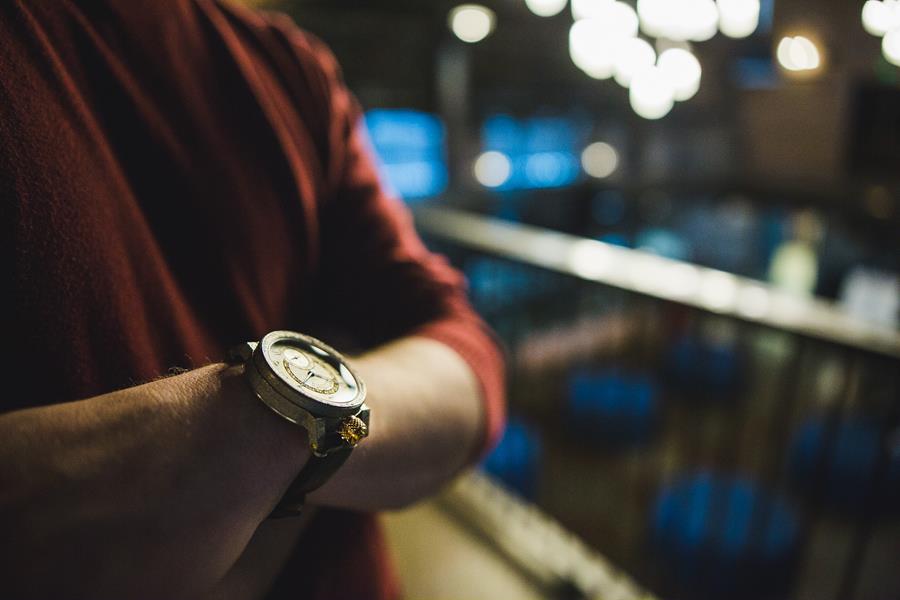 Close up of a watch on a man's wrist.