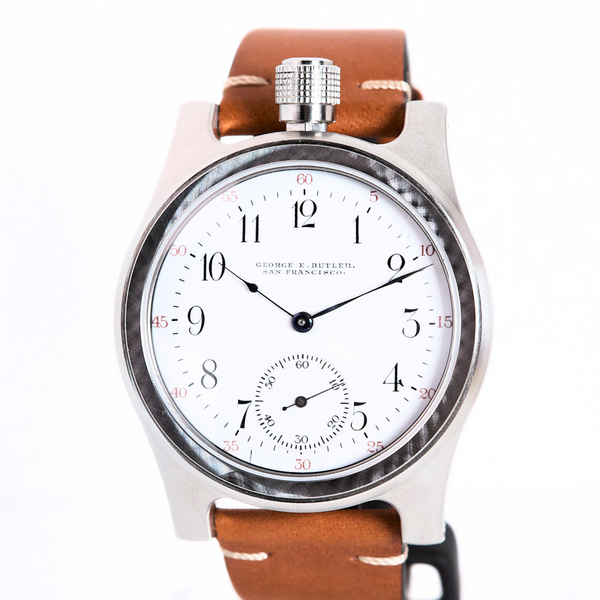Watch with a brown leather strap on a white background