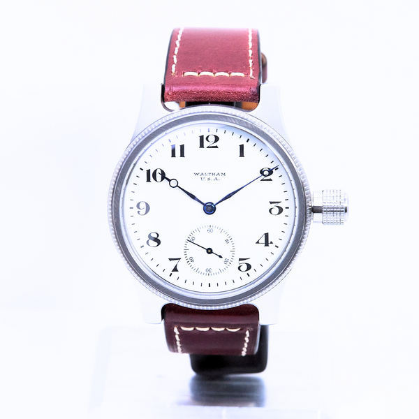 Watch with a red strap on a white background
