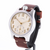 Wristwatch with brown leather strap and beige dial on a white background
