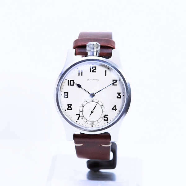 Wristwatch with a brown leather strap on a white background