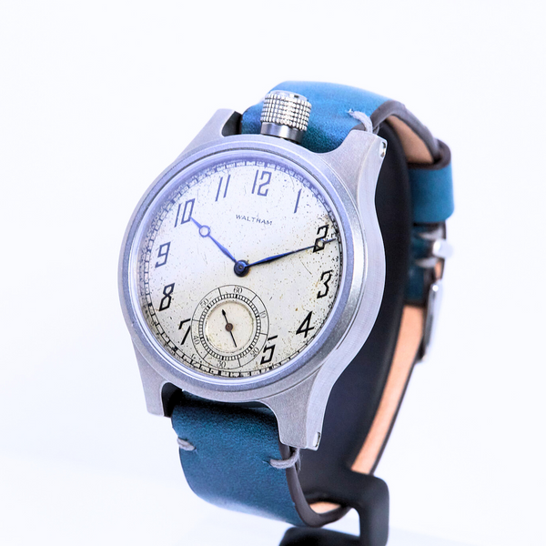 Watch with a blue strap on a white background