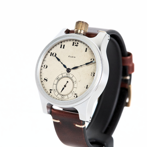 Wristwatch with a brown leather strap and silver case on a white background