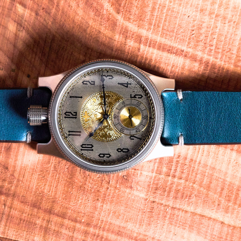 Watch with a blue strap on a wooden surface